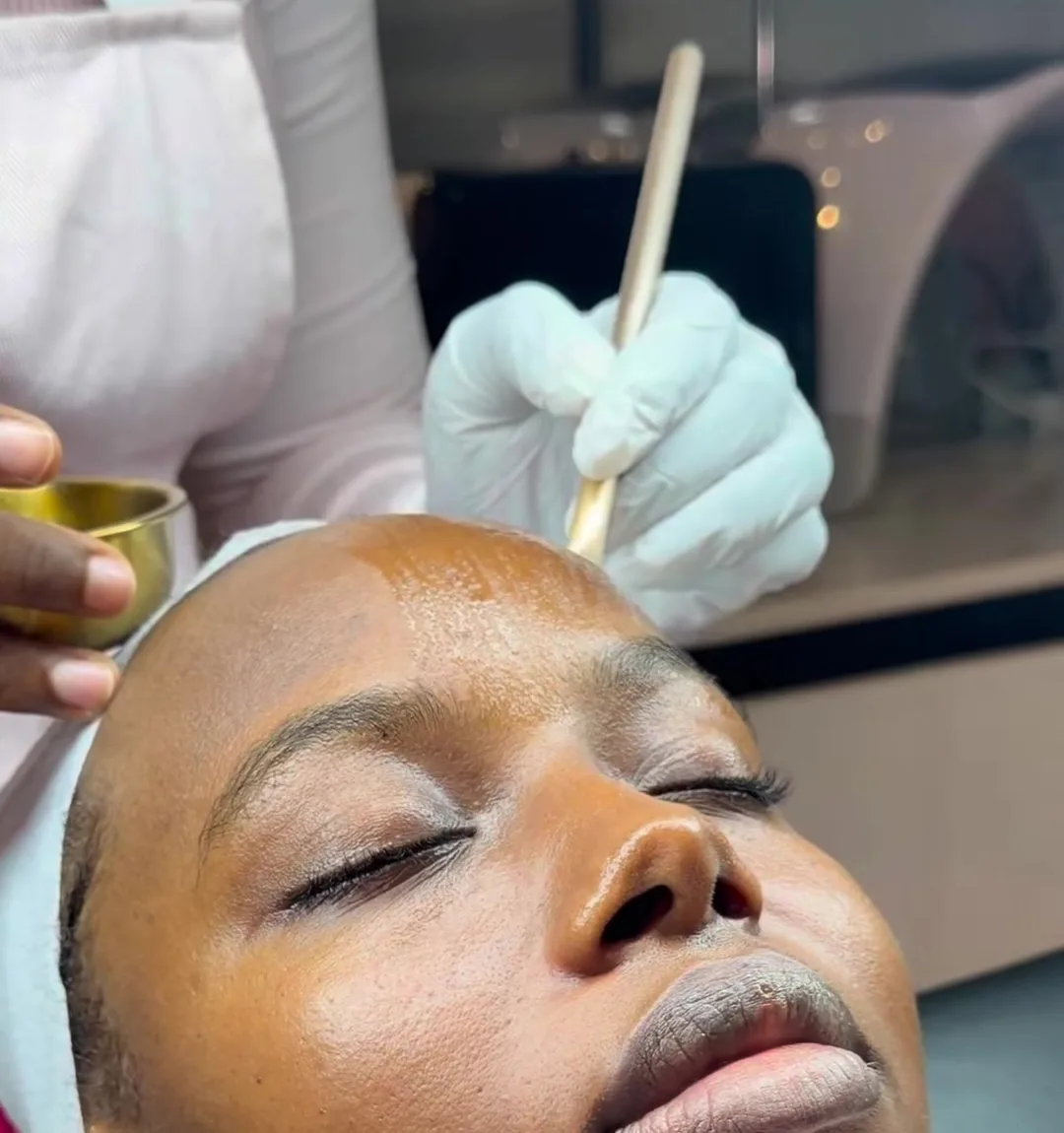 A peel being brushed on during a Skinlab facial